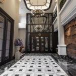 Luxurious Ashley hotel lobby with marble floor and wood wall