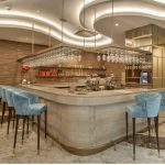 A stylish and modern hotel bar area with seating