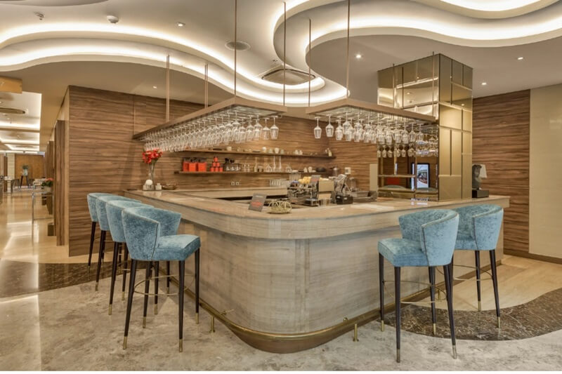 A stylish and modern hotel bar area with seating