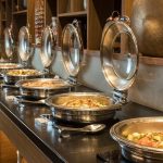 Modern hotel buffet area with food serving stations