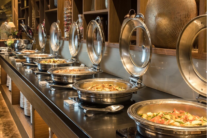 Modern hotel buffet area with food serving stations