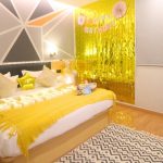 Hotel birthday room with balloons and a Happy Birthday banner