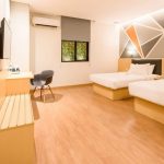 Deluxe Twin room with two single beds and a city view