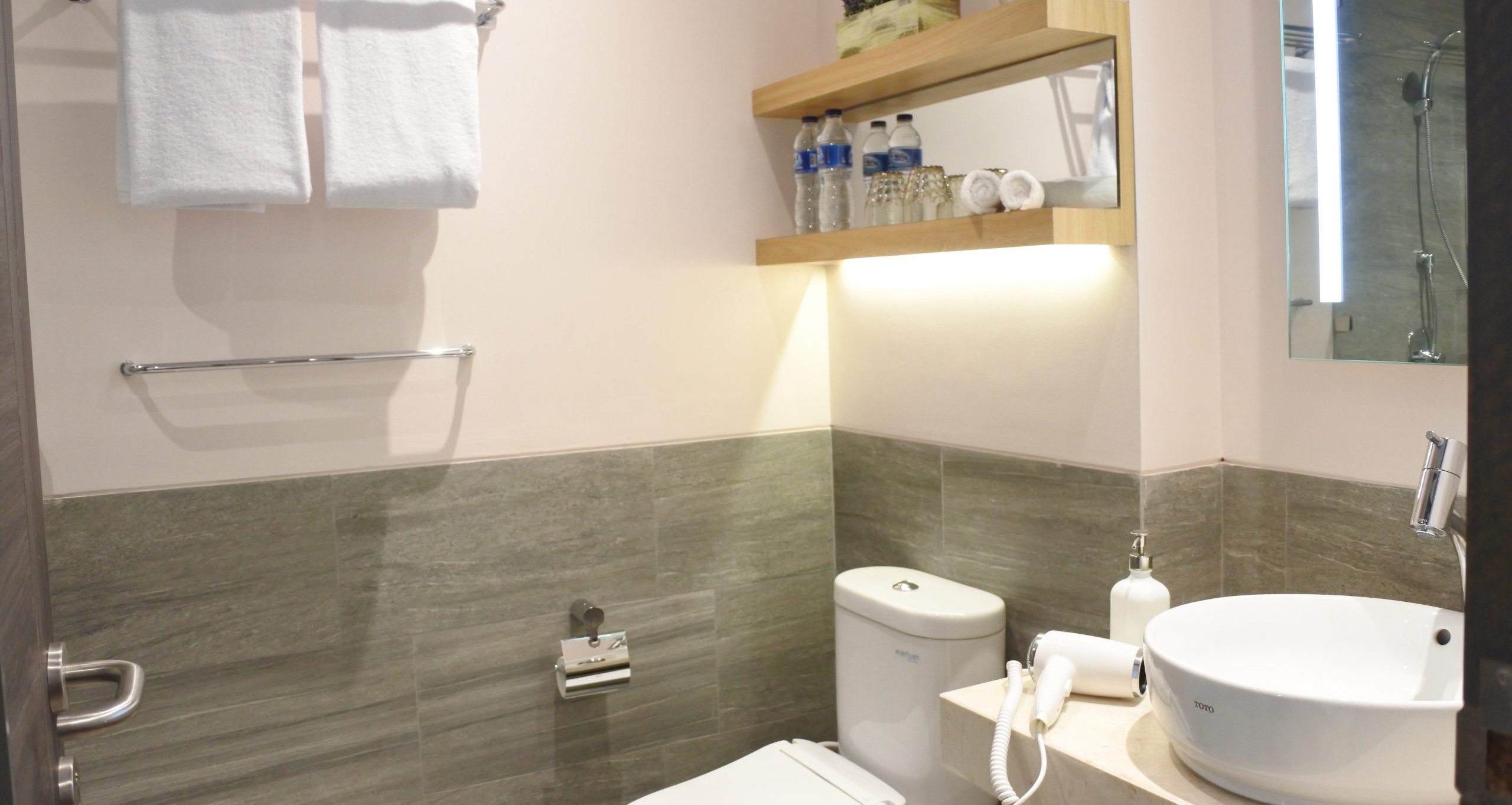 Executive deluxe bathroom with a backlit mirror