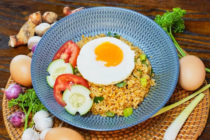 A plate of Nasi Goreng Eyang with a fried egg on top