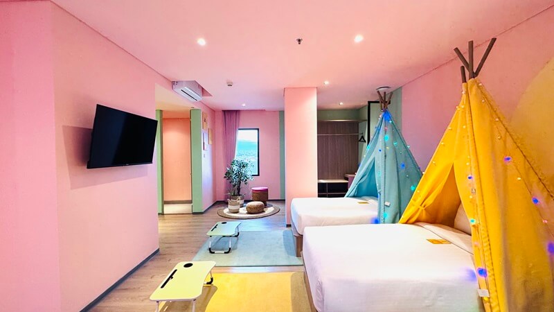 A modern deluxe thematic hotel room with a large bed