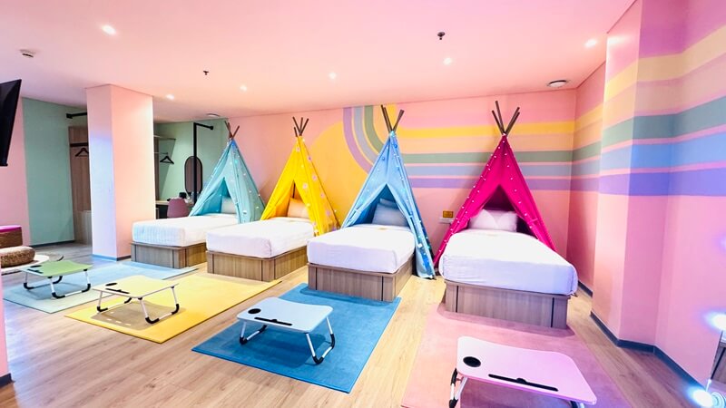 Deluxe Thematic hotel room with a large bed and lamps