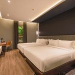 Deluxe Triple hotel room with three single beds