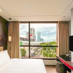 Deluxe View Double room with two beds and a large window