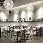 A bright, modern dining area with wooden tables