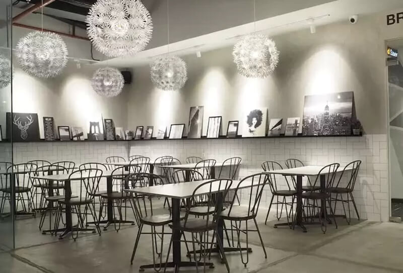 A bright, modern dining area with wooden tables