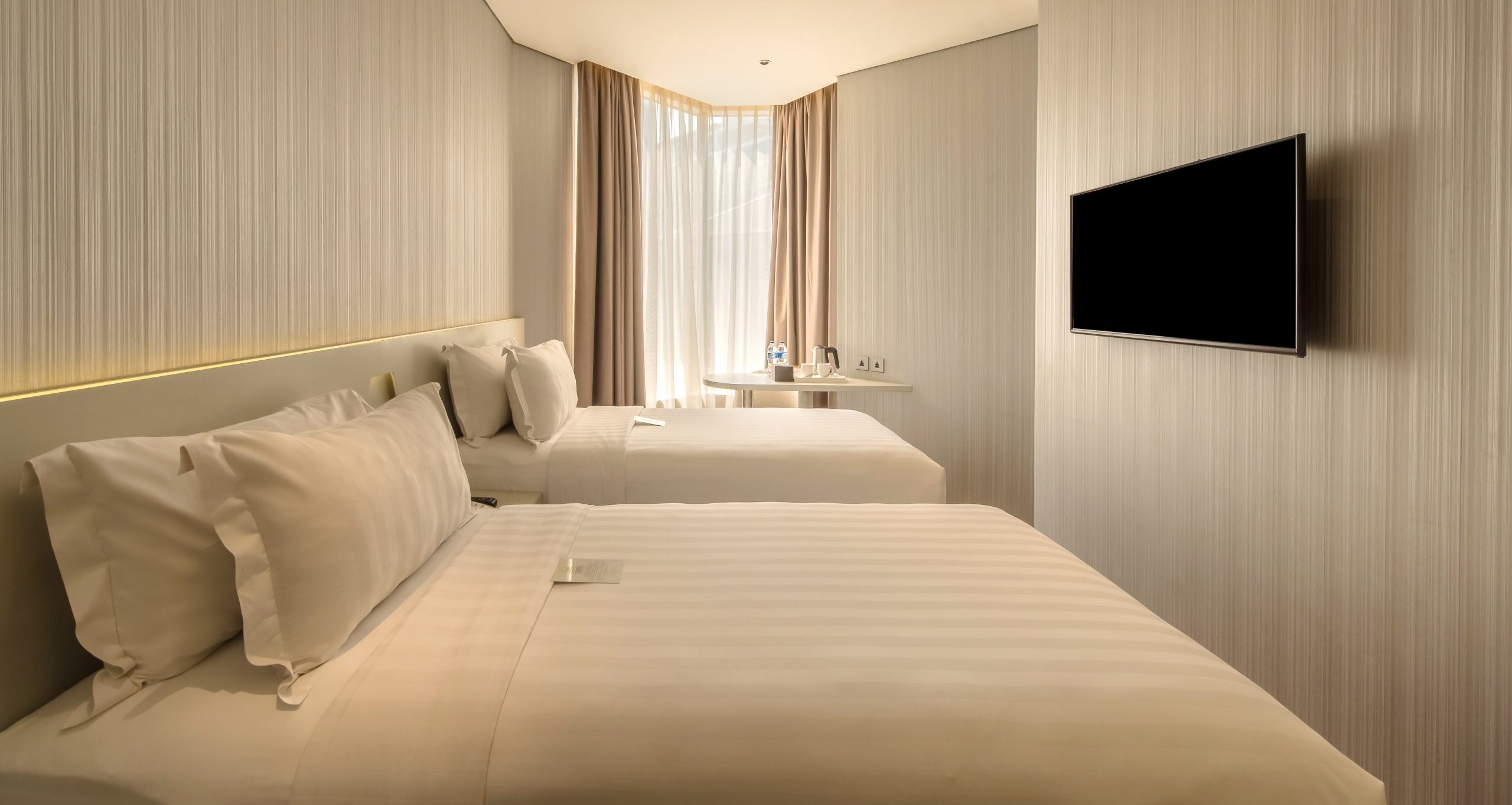 Deluxe Twin room at Ashley Wahid Hasyim hotel