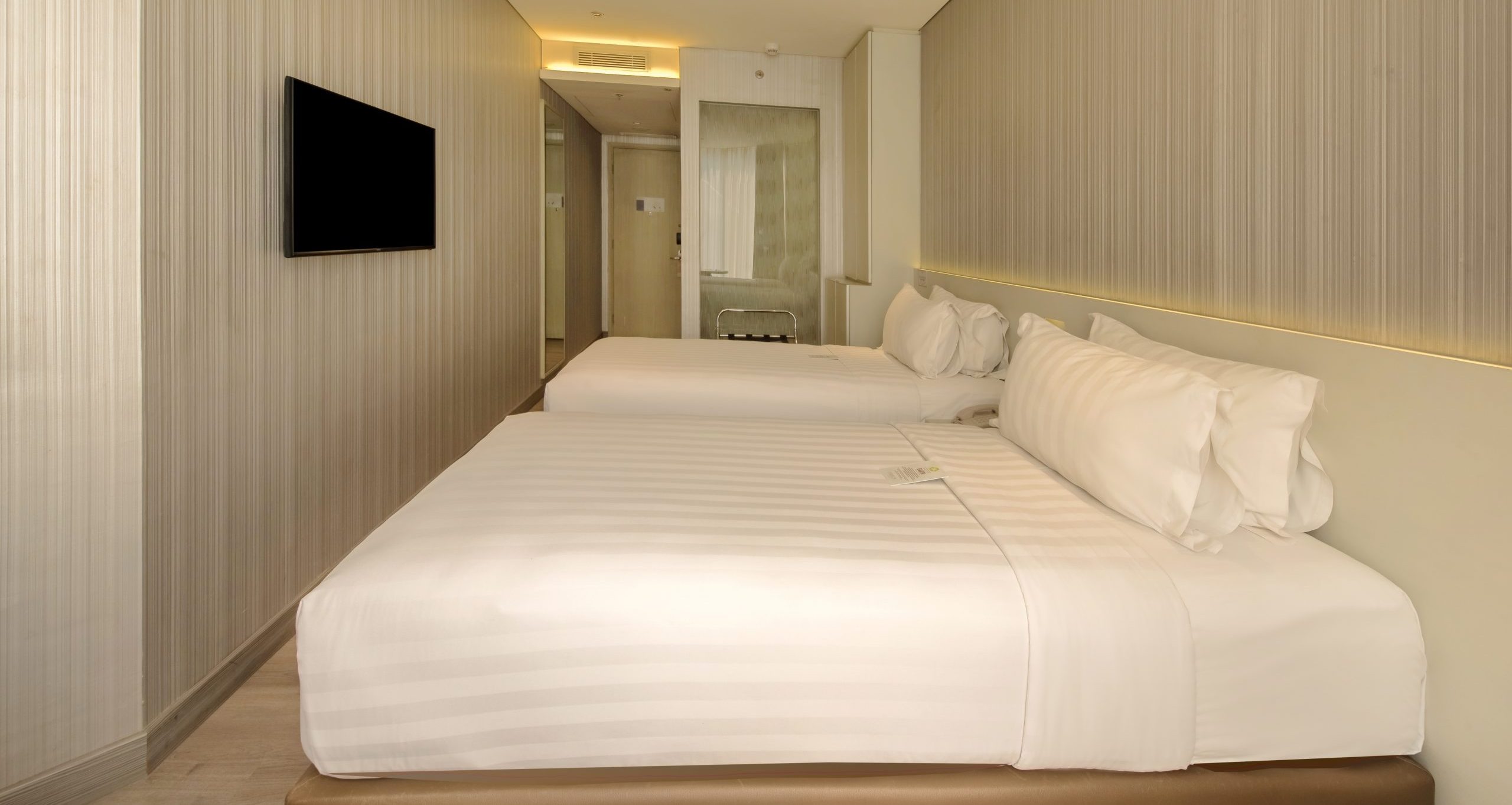Deluxe Twin room at Ashley Wahid Hasyim hotel