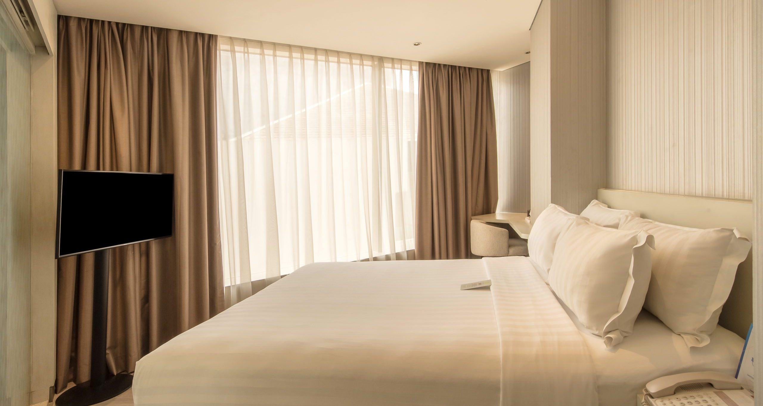 Deluxe Twin room at Ashley Wahid Hasyim hotel