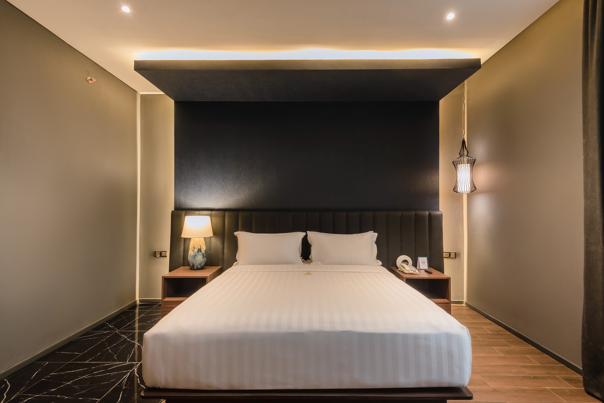 Modern Ashley Hotel Group room with a large bed