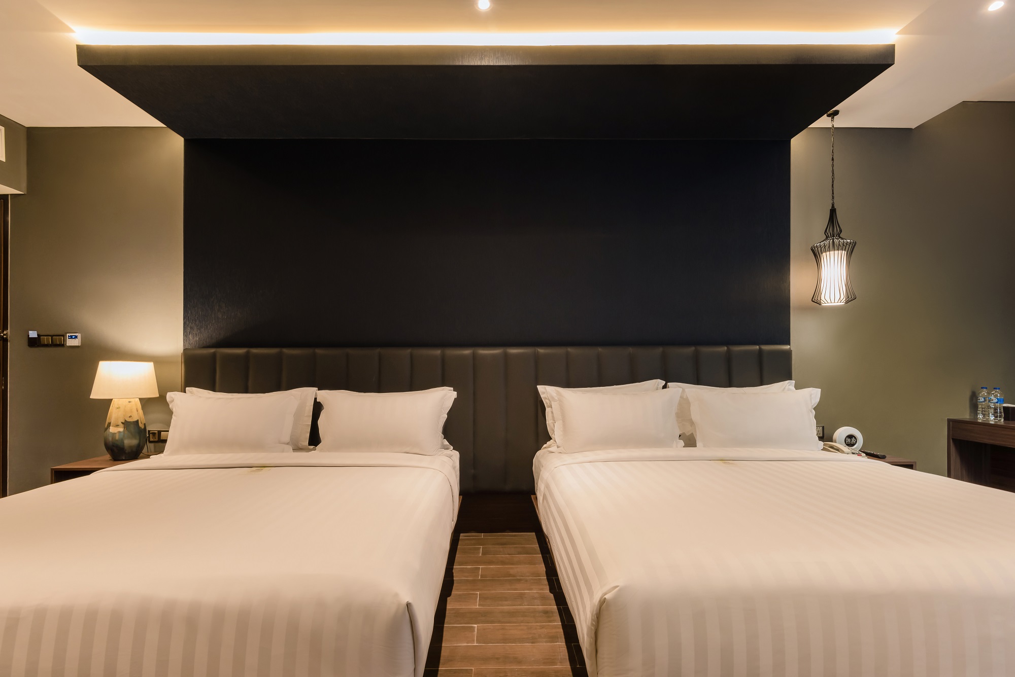 Modern twin bedroom at Ashley Hotel Group
