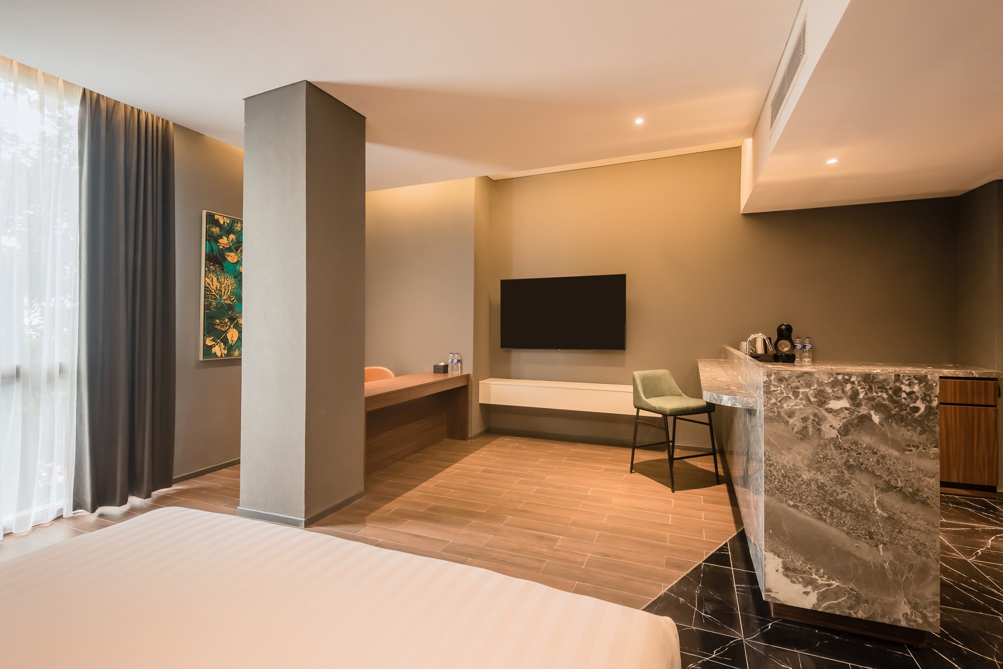 Ashley Hotel room with a bed and large window