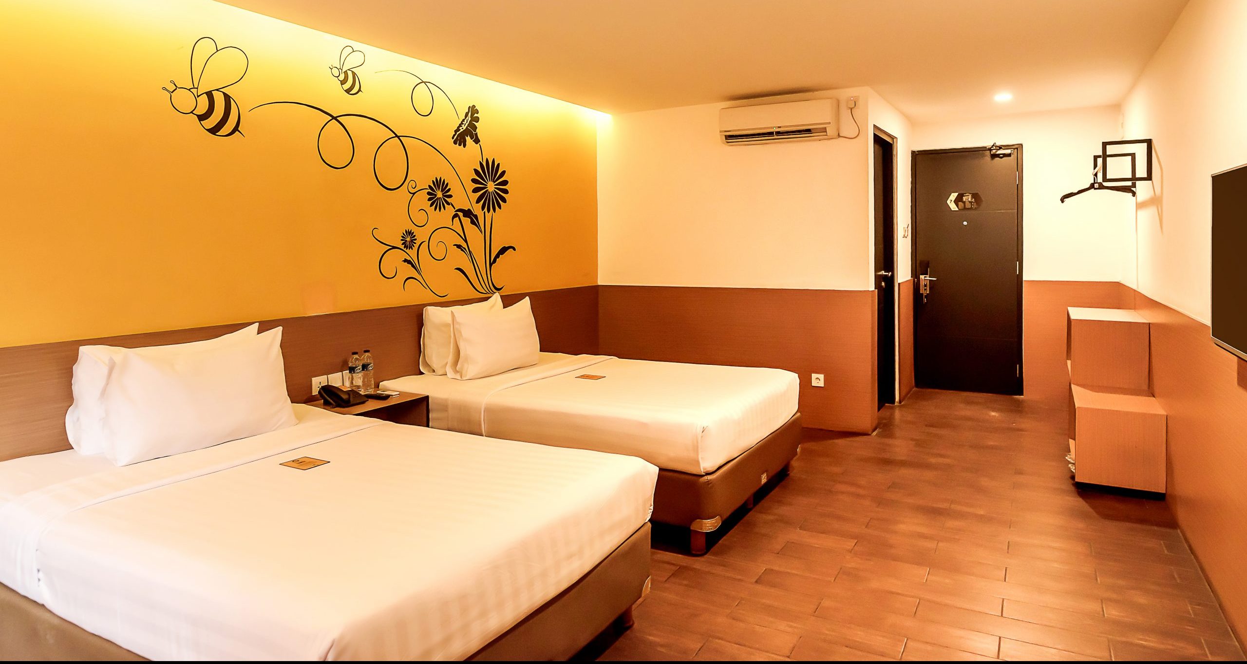 Superior twin room with yellow accents at Yellow Bee Hotel