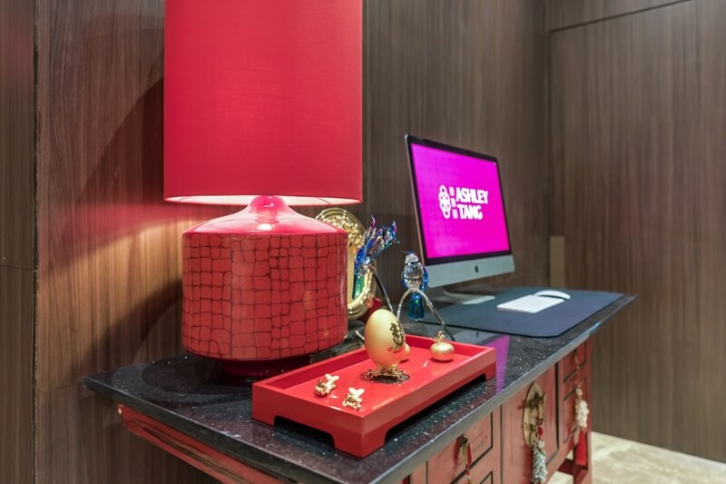 Ashley Hotel Group room corner with a chair and table