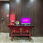 E-corner with a chair and lamp at Ashley Hotel Group