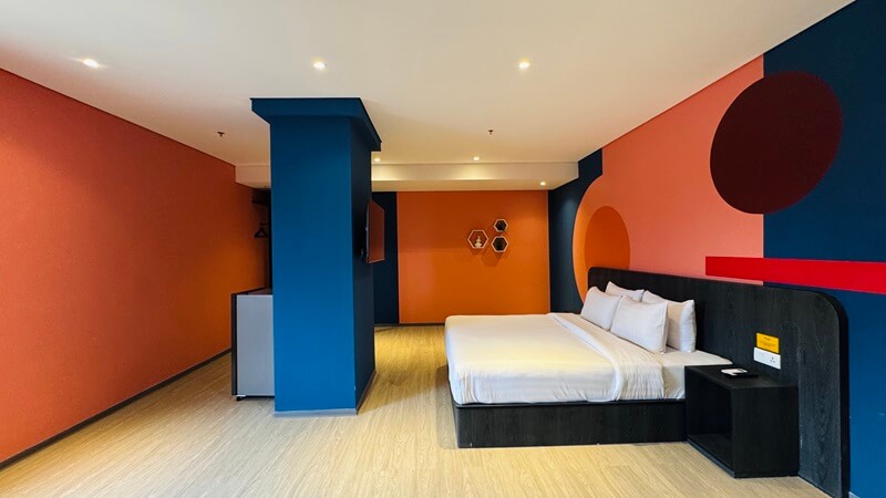 Executive hotel room with a king bed and modern decor