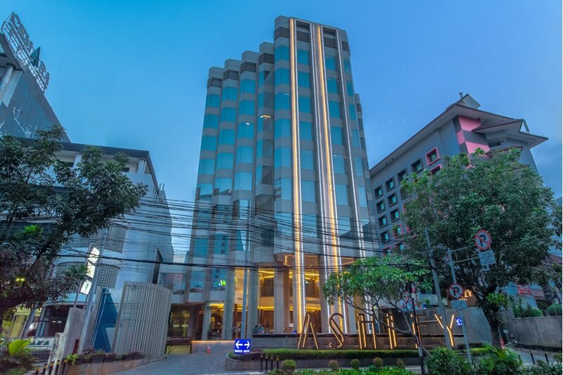 Exterior of the Ashley Hotel building at dusk