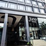 Exterior of the modern Juno Hotel building