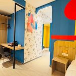 Modern family room in a hotel with two beds
