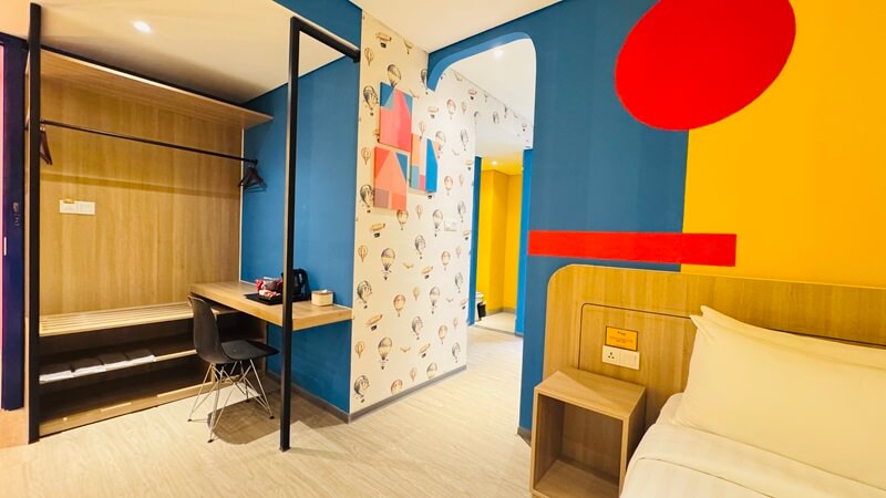 Modern family room in a hotel with two beds