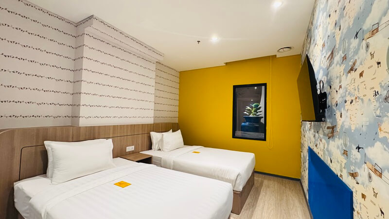 Family room with two beds and modern wooden decor