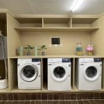 Laundry room at Yellow Bee Tangerang with three washers