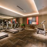 Modern fitness centre with treadmills and ellipticals