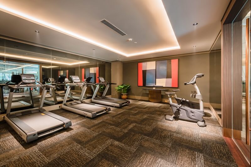Modern fitness centre with treadmills and ellipticals