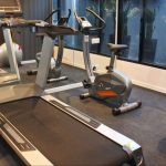 Modern fitness centre with treadmills and large windows