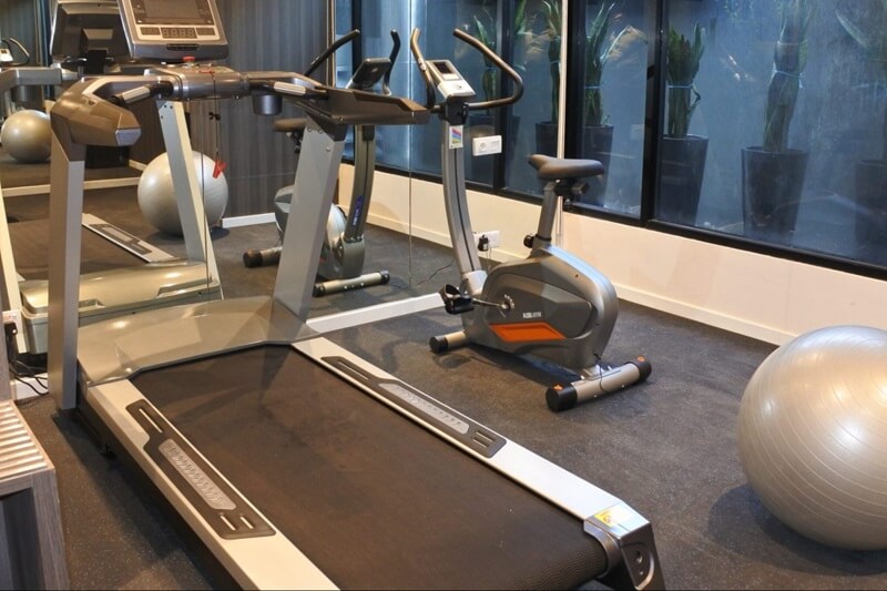 Modern fitness centre with treadmills and large windows