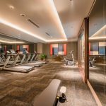 Modern fitness centre with treadmills and large windows