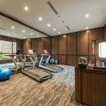 Modern fitness centre with a row of treadmills