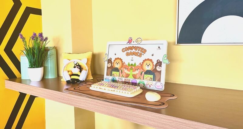 A cozy games corner with a foosball table and dartboard