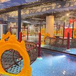 A large indoor waterpark with multiple water slides
