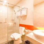 Modern JUJT bathroom with a large backlit mirror