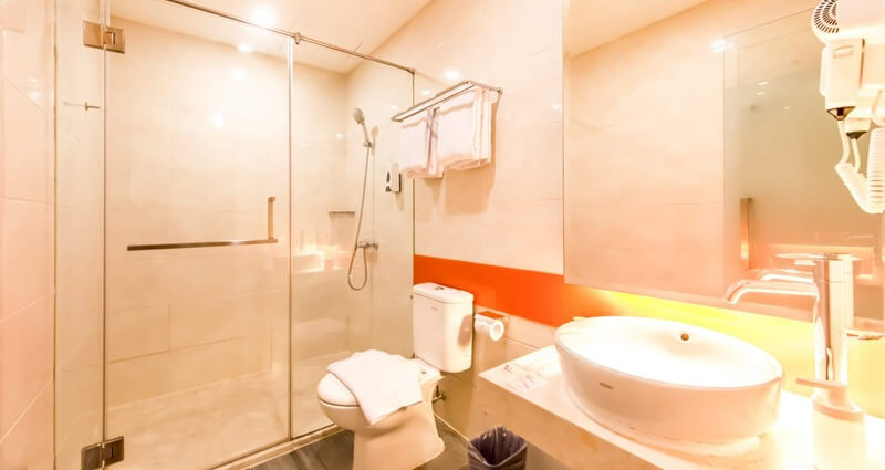 Modern JUJT bathroom with a large backlit mirror