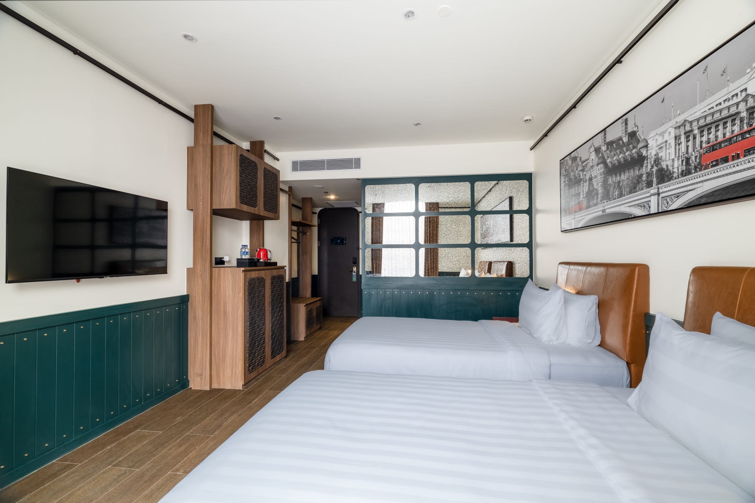 Deluxe twin hotel room 312 with two beds and a window