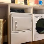 Modern laundry room with rows of washing machines