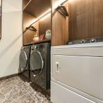 Modern laundry room with white washer and dryer