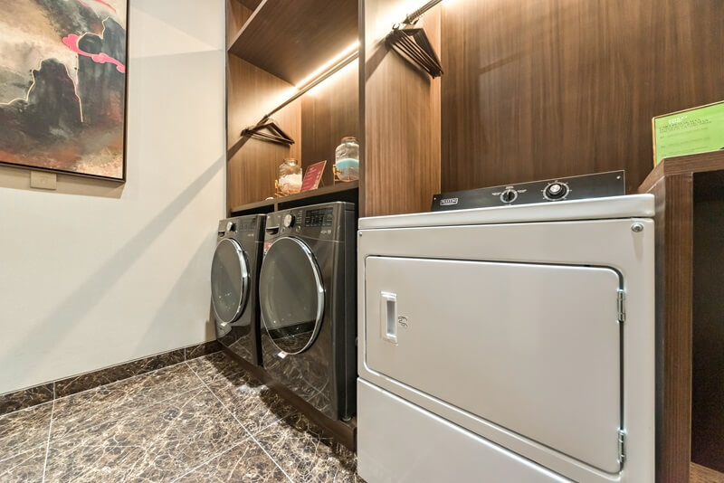 Modern laundry room with white washer and dryer