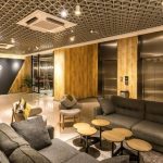 Modern hotel lobby with a reception desk and seating