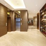 Modern hotel lobby with a reception desk and seating area