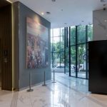 Modern hotel lobby area with a reception desk