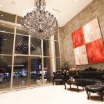 Luxurious lobby with chandelier and black leather seating