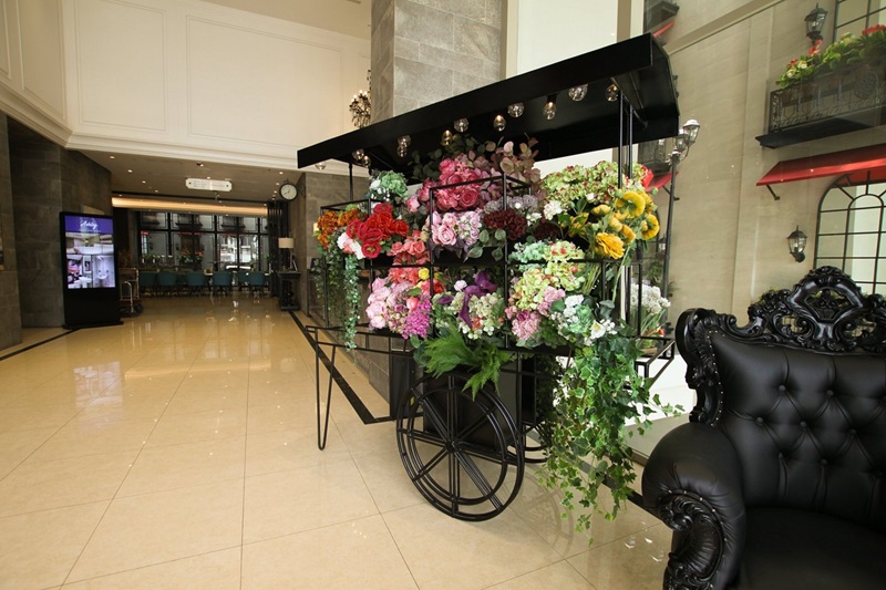 A stylish lobby corner with a modern armchair and plant